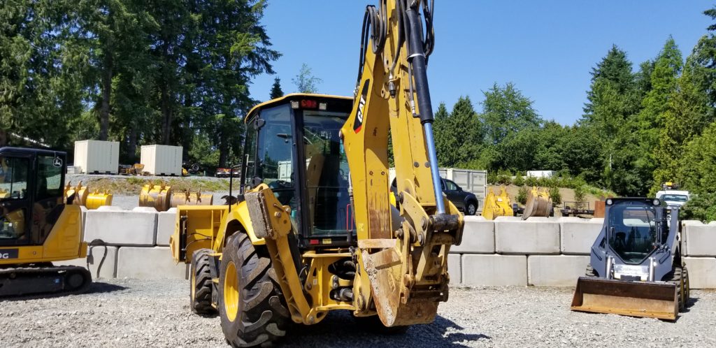 Caterpillar backhoe landscaping